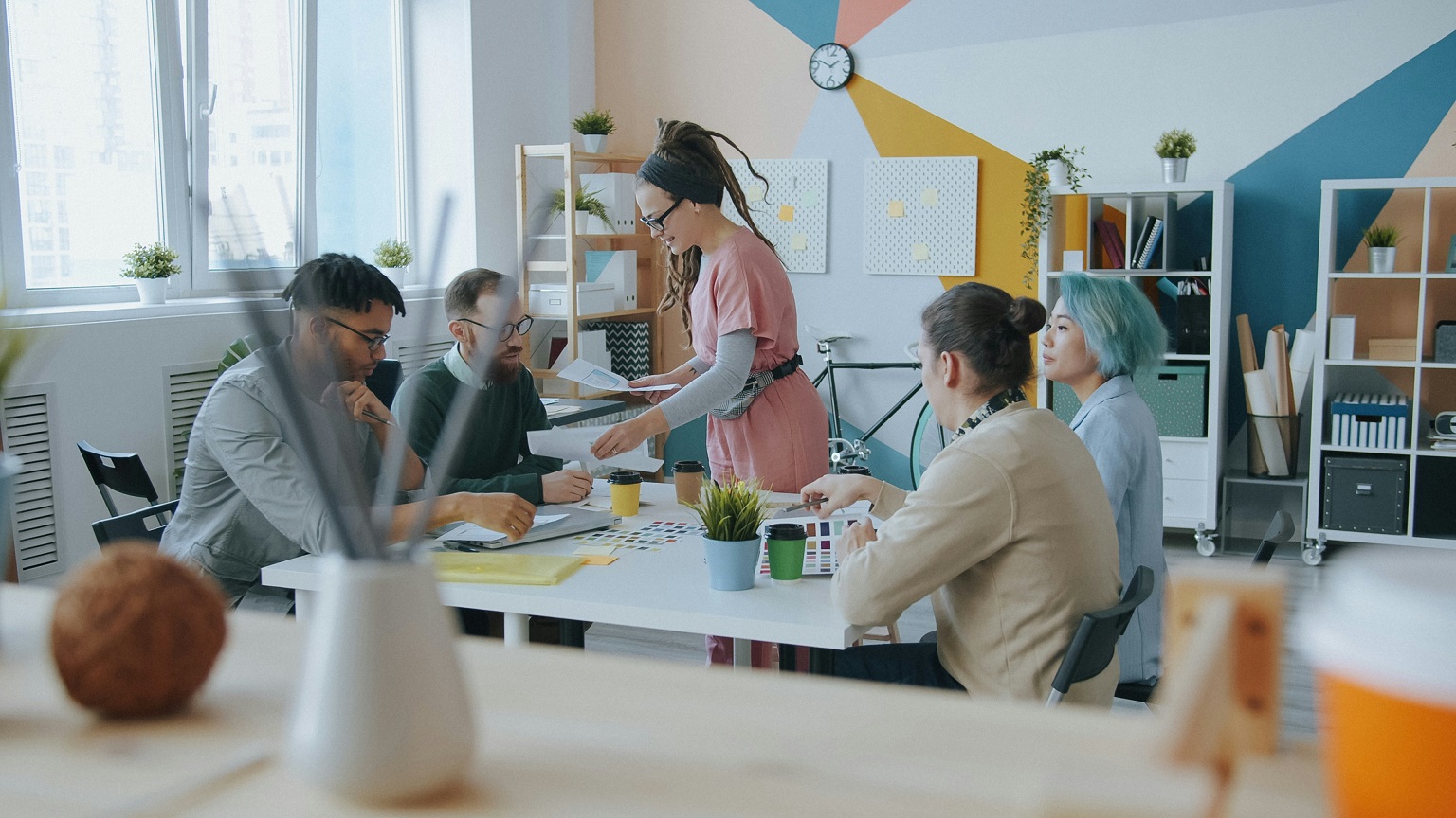 A team discussing a project together around a table