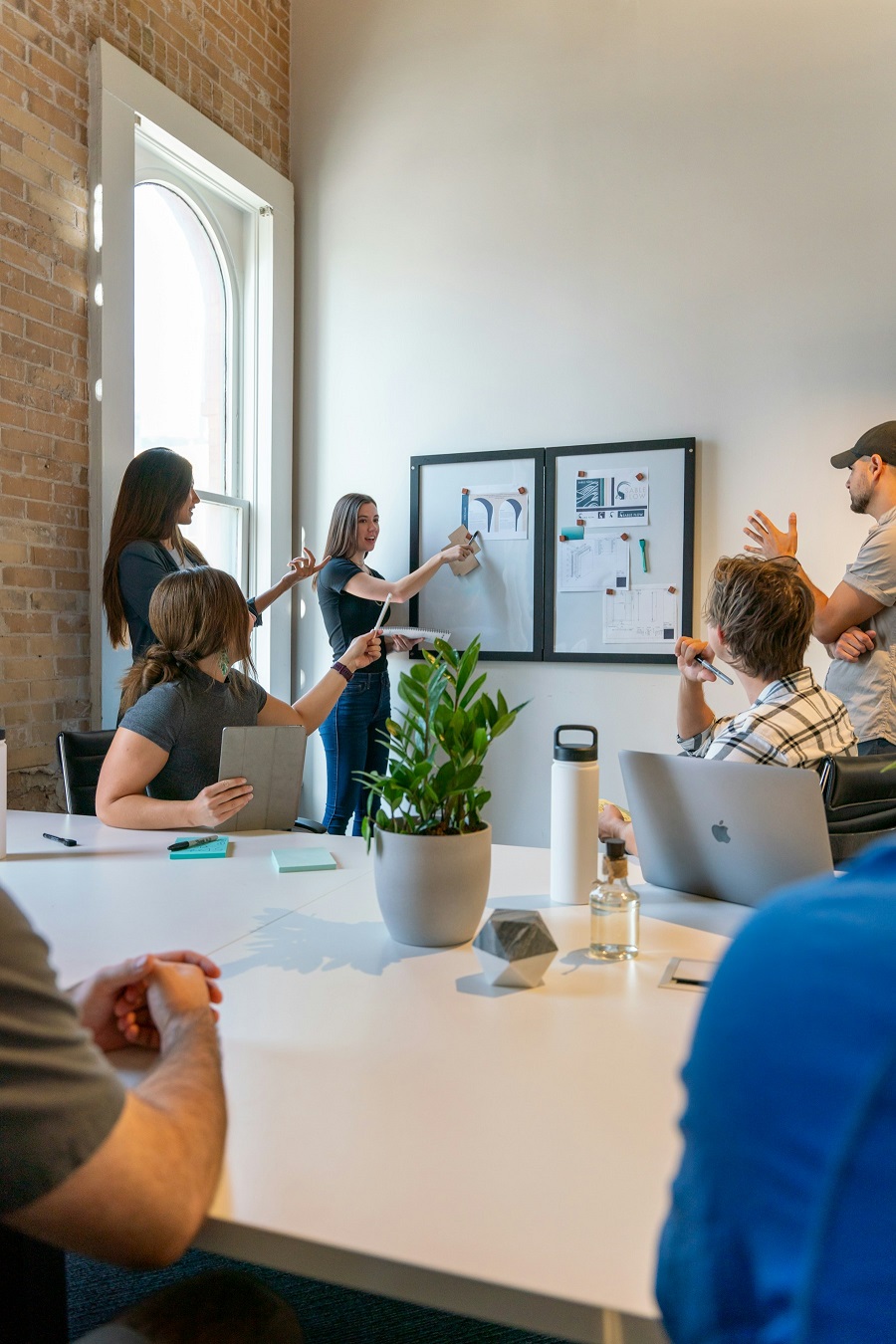 A team collaborating around a table while building a product
